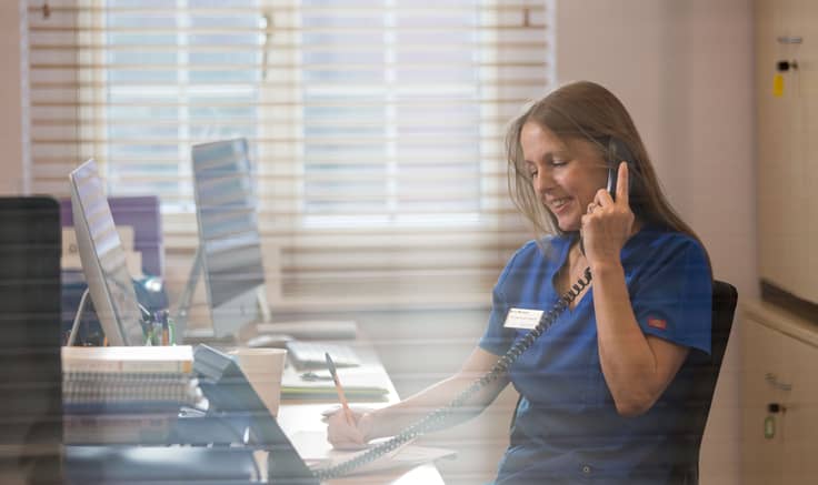 Taymount nurse at her desk